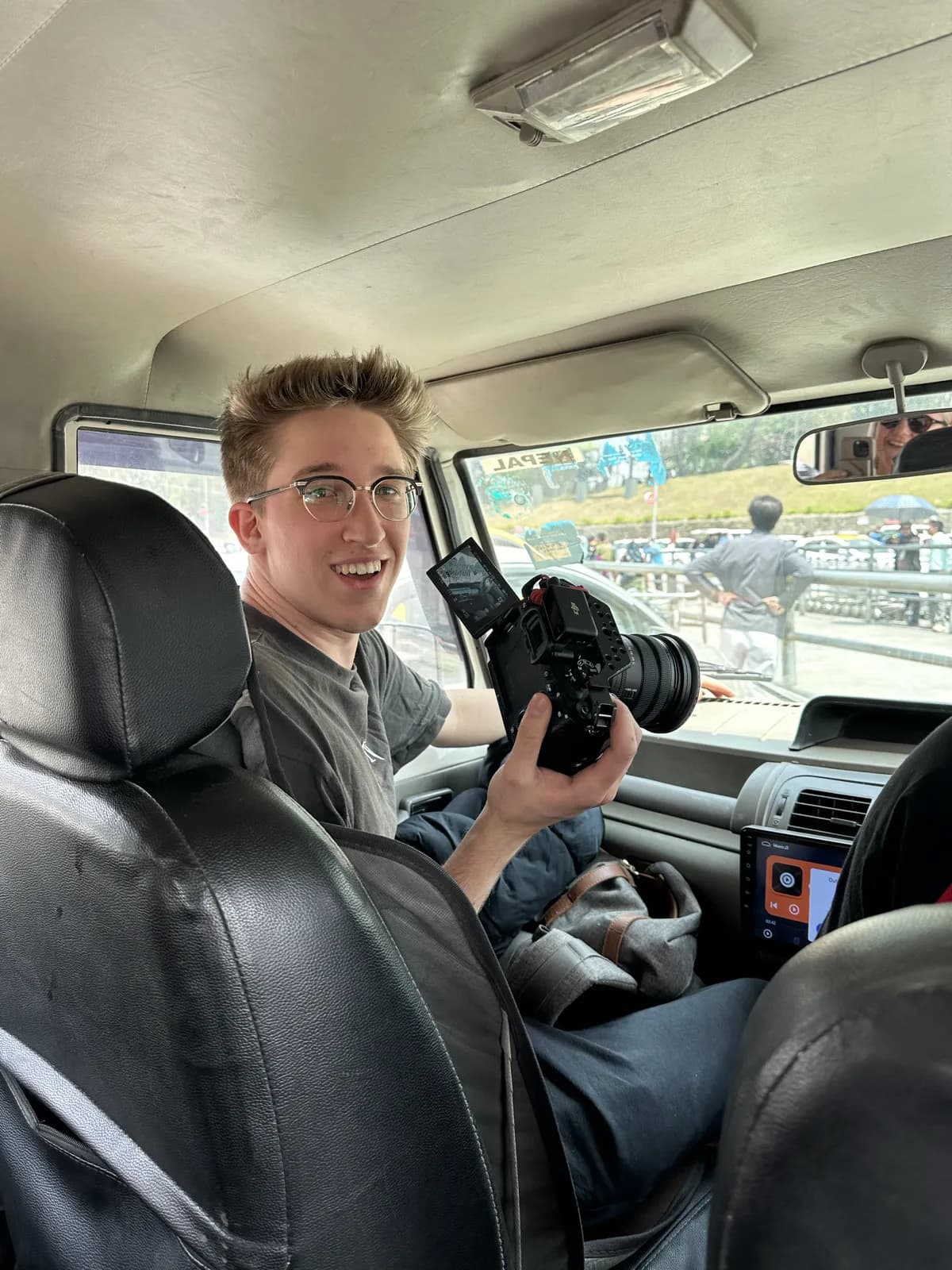 Filming from the road in Nepal, mirrorless camera in hand